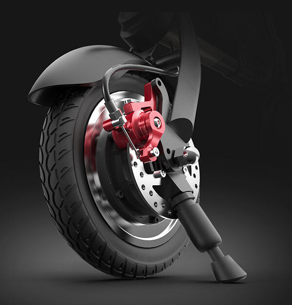 FRONT AND REAR DISC BRAKES ENSURE RIDING SAFETY with text